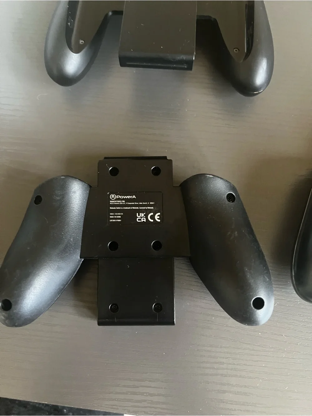 Nintendo Switch Joy-Con comfort grip and a black Joy-Con wrist strap. Used